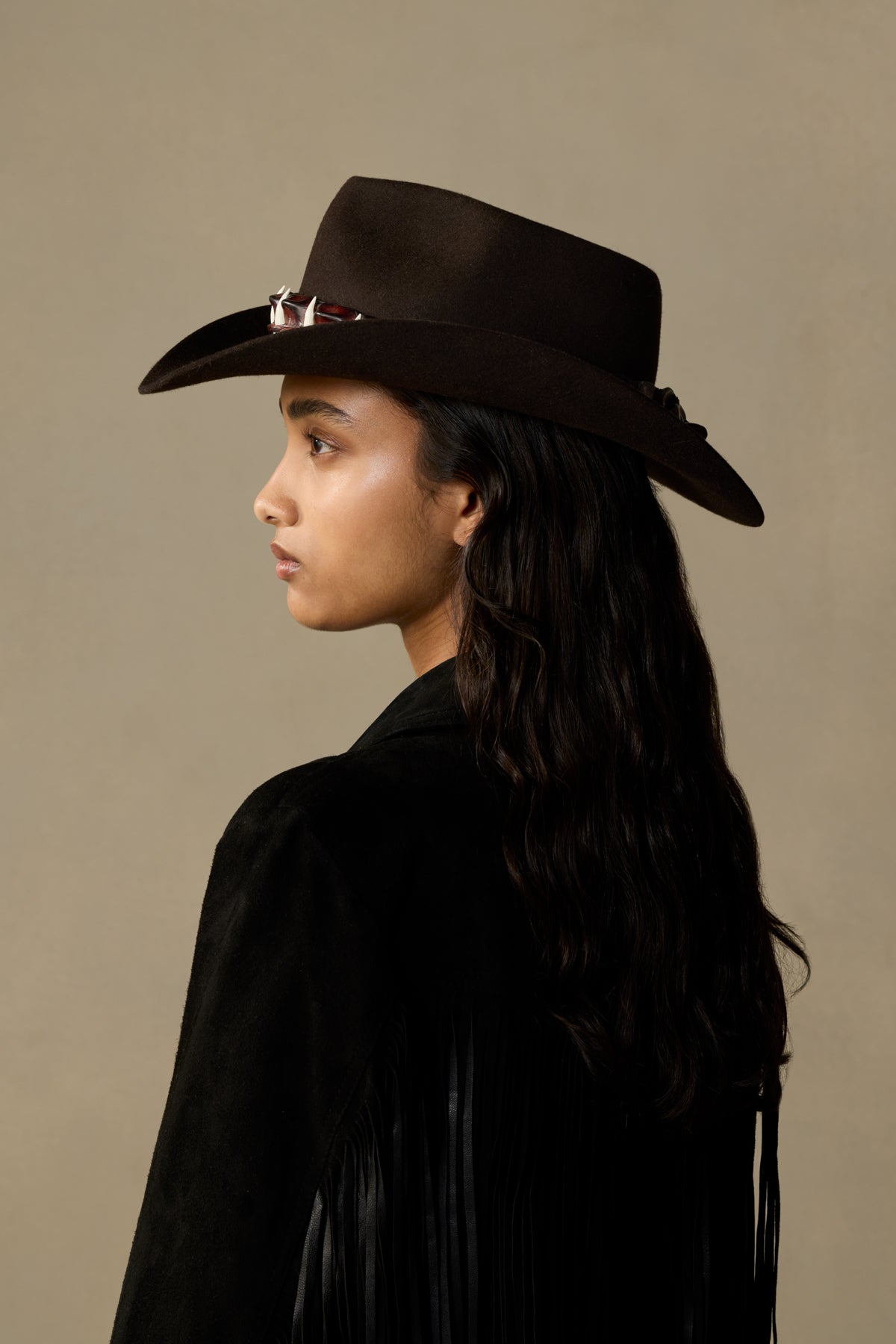 Black Croc Tanbark cowboy hat with silver band detail, worn by person with long dark hair against neutral background