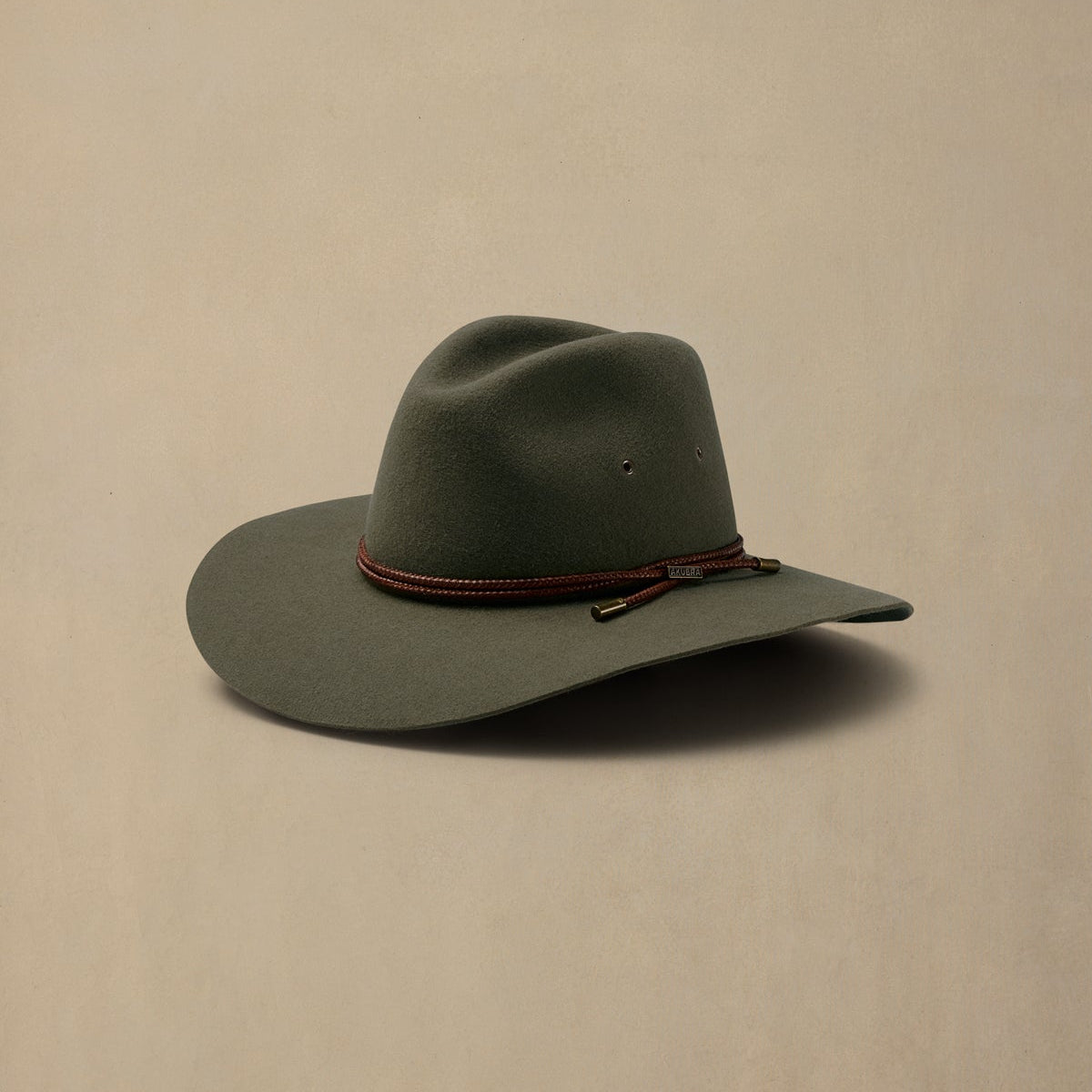 Fern green rabbit fur felt cowboy hat with burgundy cord band, displayed against neutral background