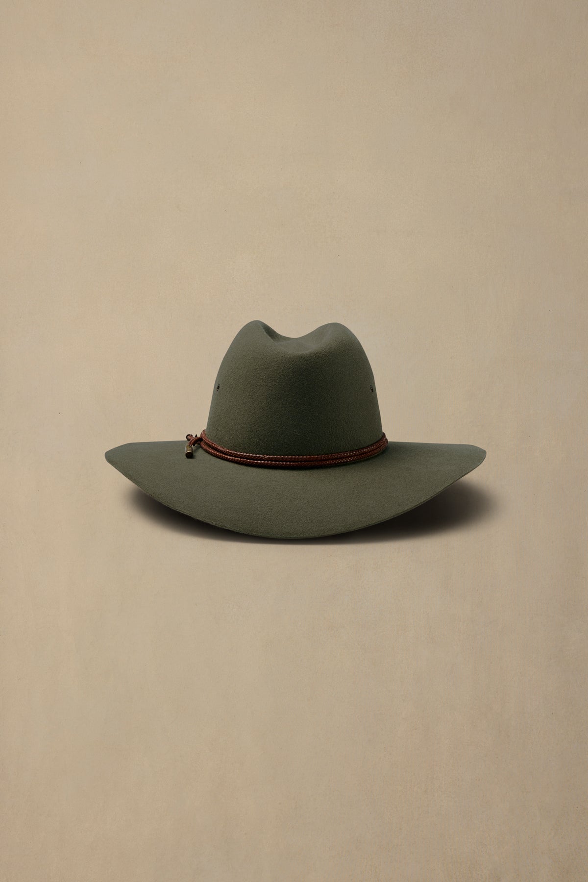 Fern green rabbit fur felt Stetson-style cowboy hat with burgundy beaded band, displayed against neutral beige background