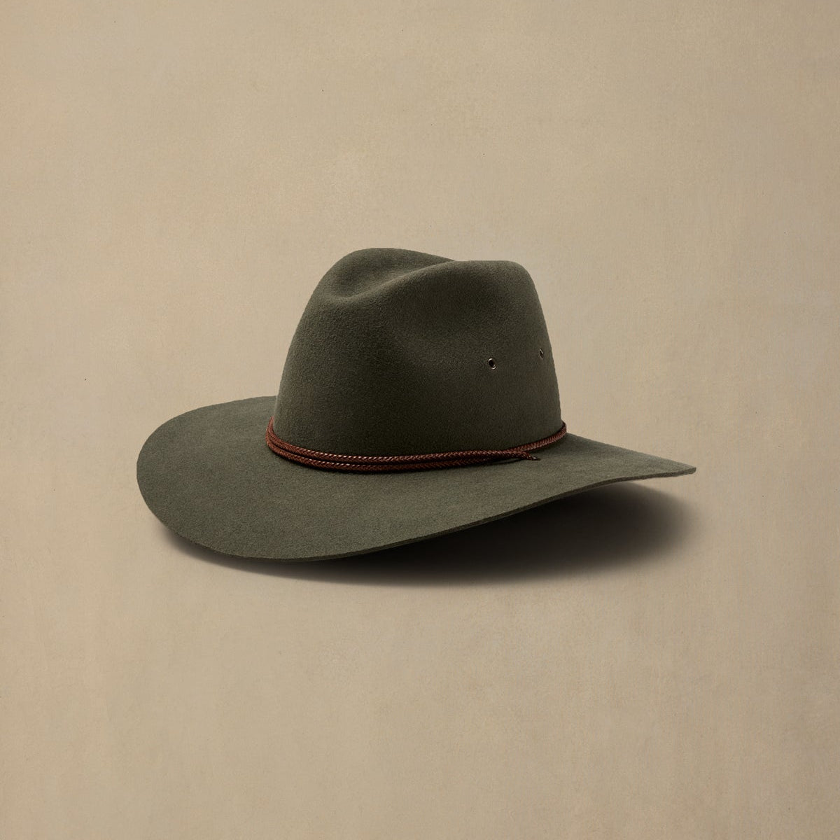 Fern green rabbit fur felt cowboy hat with red cord band, displayed against neutral background