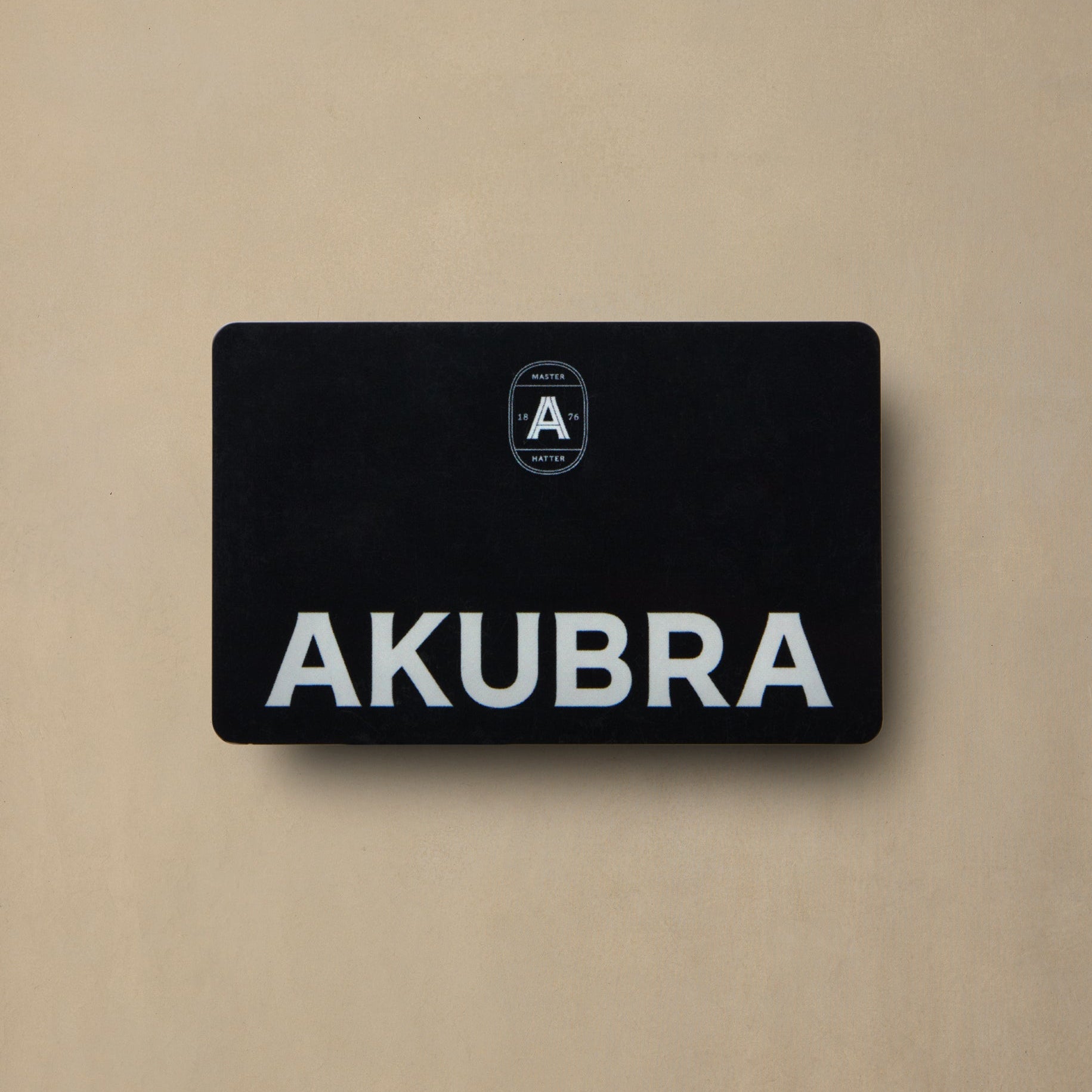Black AKUBRA gift card with white text and logo on beige background