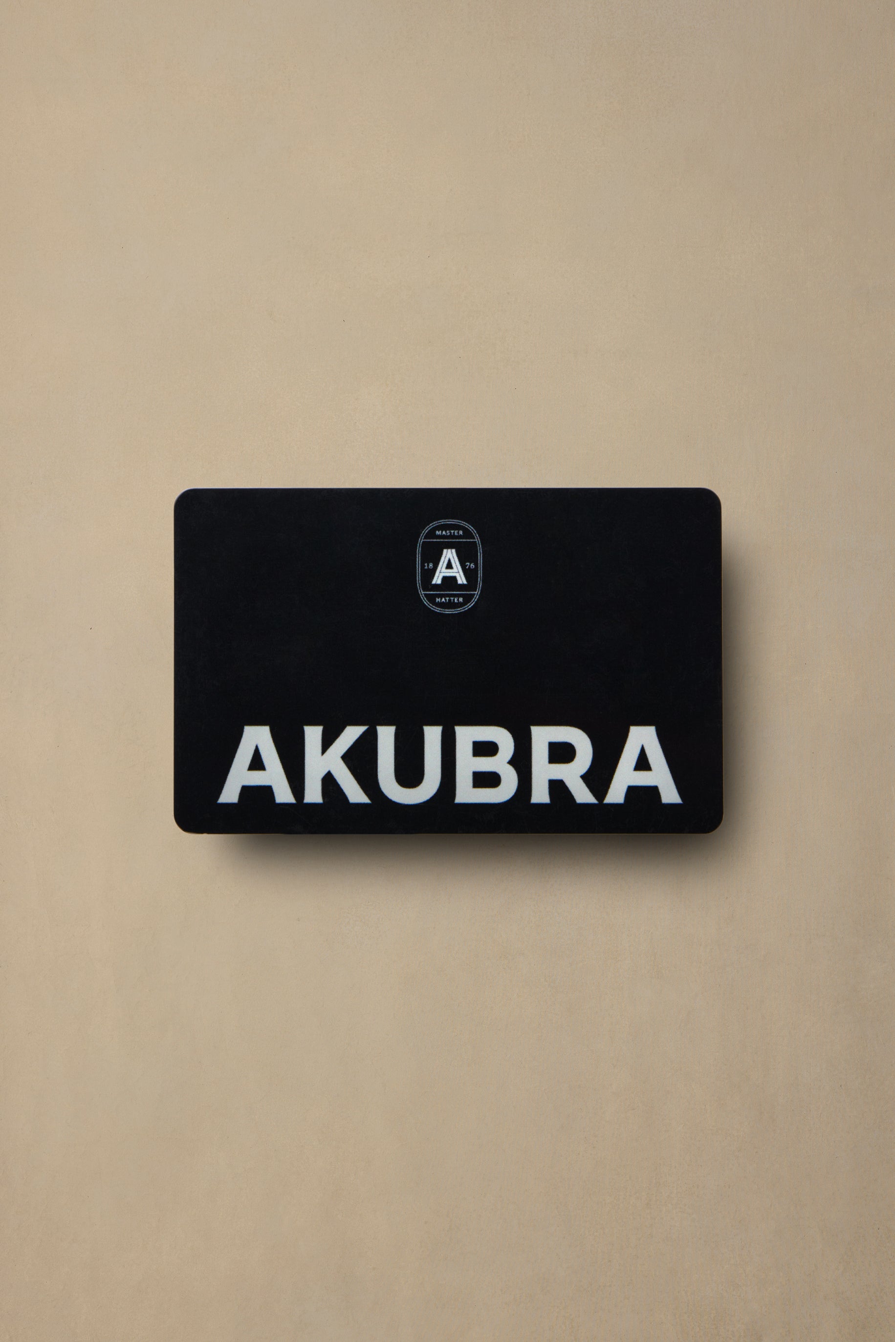 Black AKUBRA gift card with white text and logo on beige background