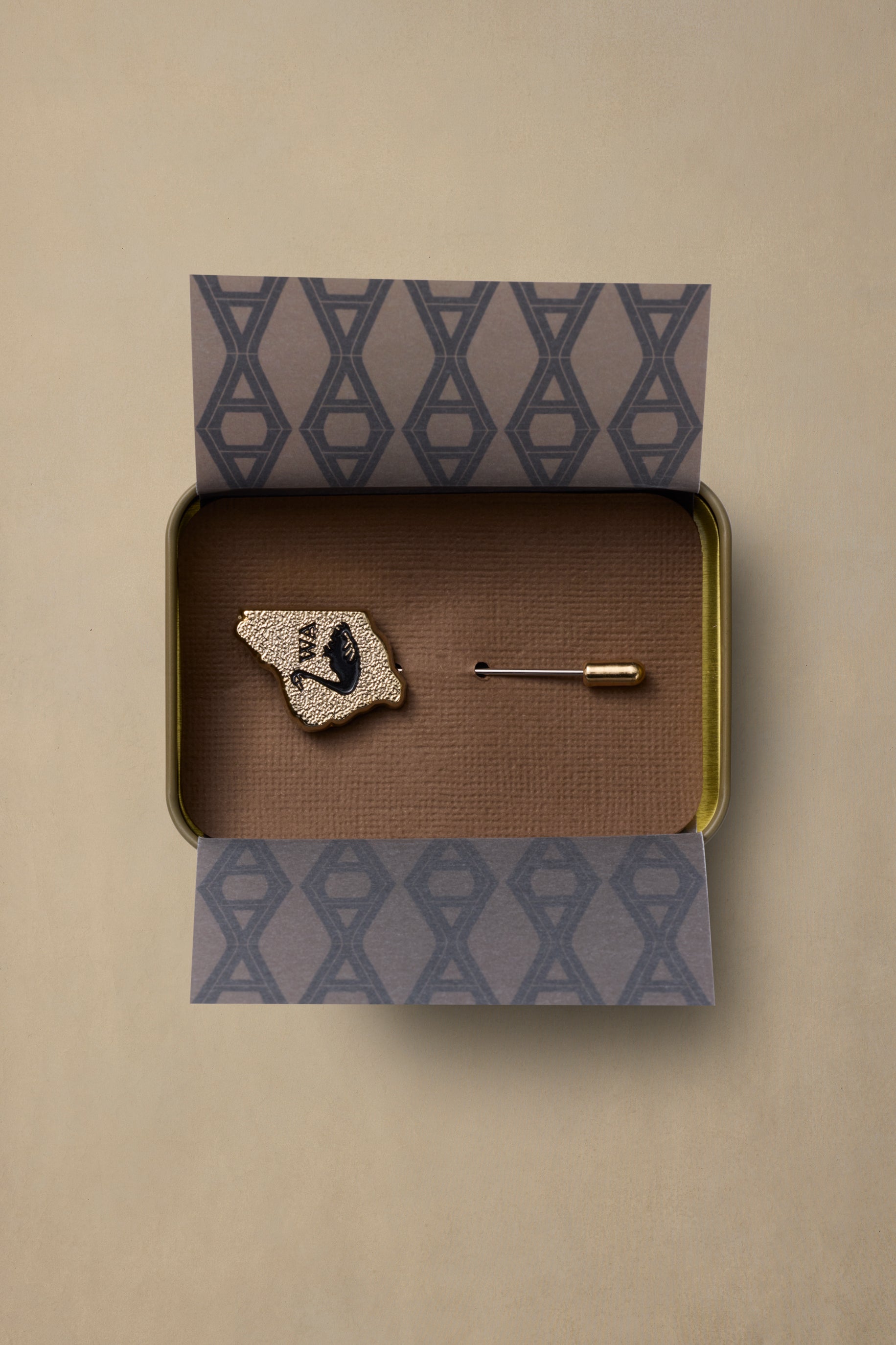 Gold textured Washington state pin with black heart detail in branded box packaging